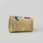 Woven Straw Market Tote Bag with Embroidered Winking Face Design